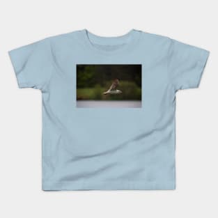 Gull flying in rain Kids T-Shirt